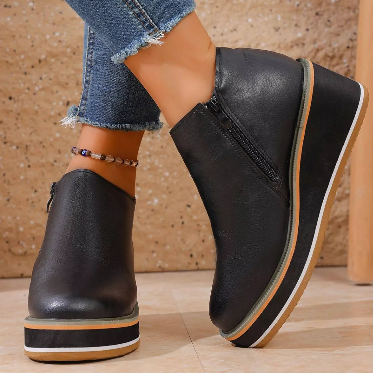 Women's round toe wedge ankle boots by Trendsi, showcasing stylish ankle-high design with a comfortable wedge heel.