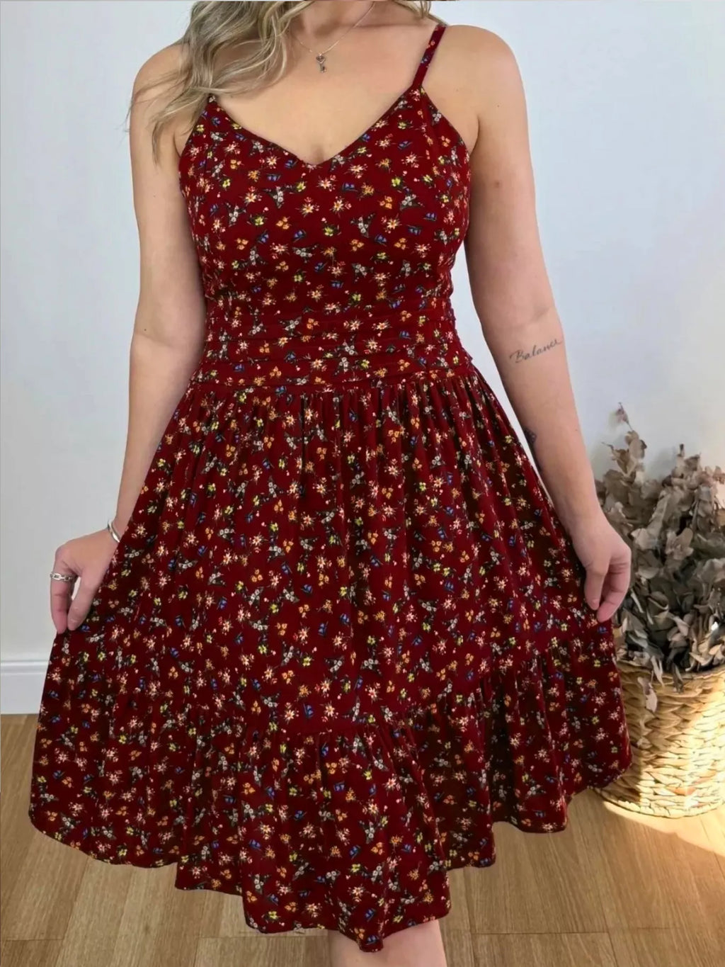 Floral print spaghetti strap midi dress with ruffle hem by Trendsi, featuring a flowy design and vibrant floral pattern.
