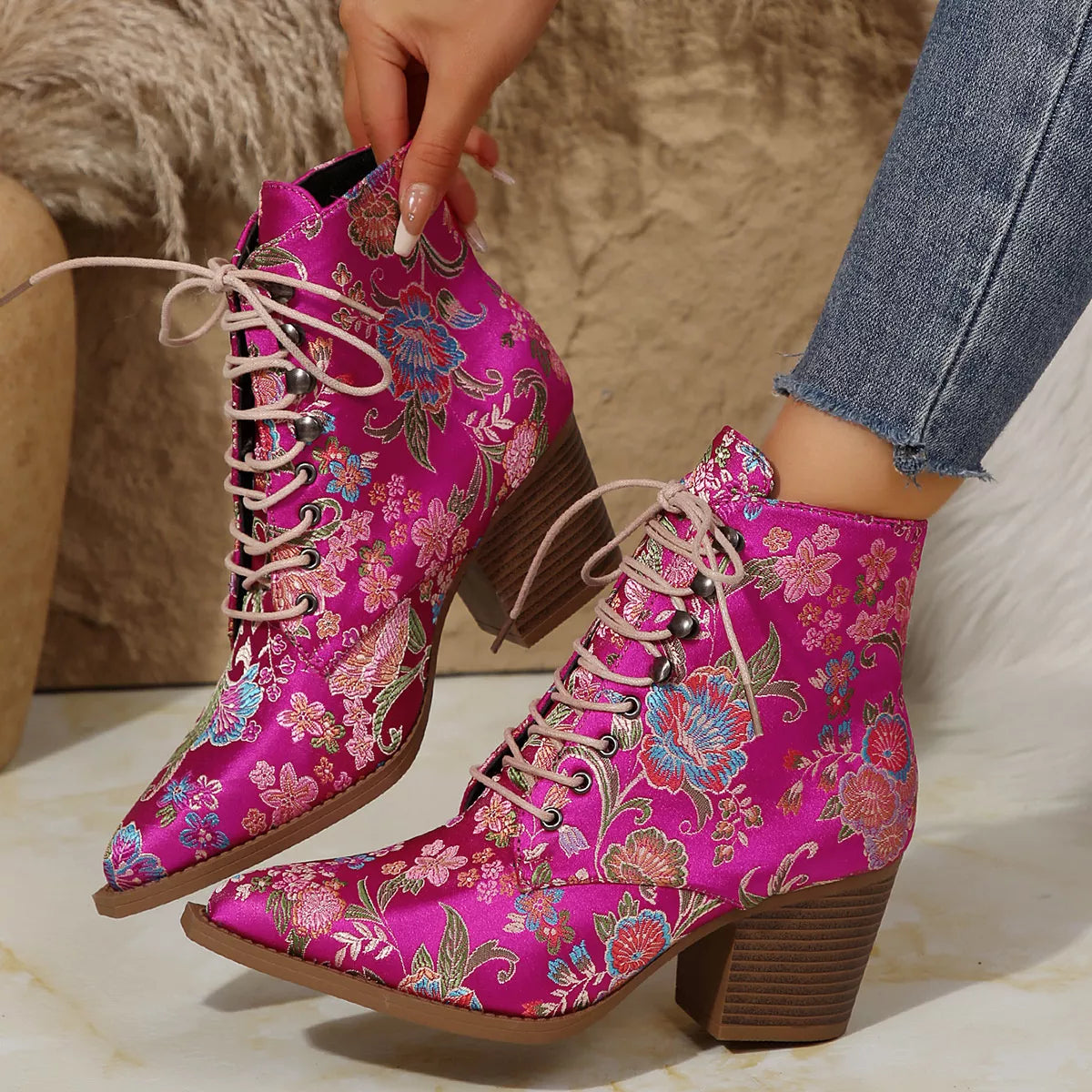 Point toe block heel boots from Trendsi featuring sleek black footwear with a stylish design and sturdy block heels.