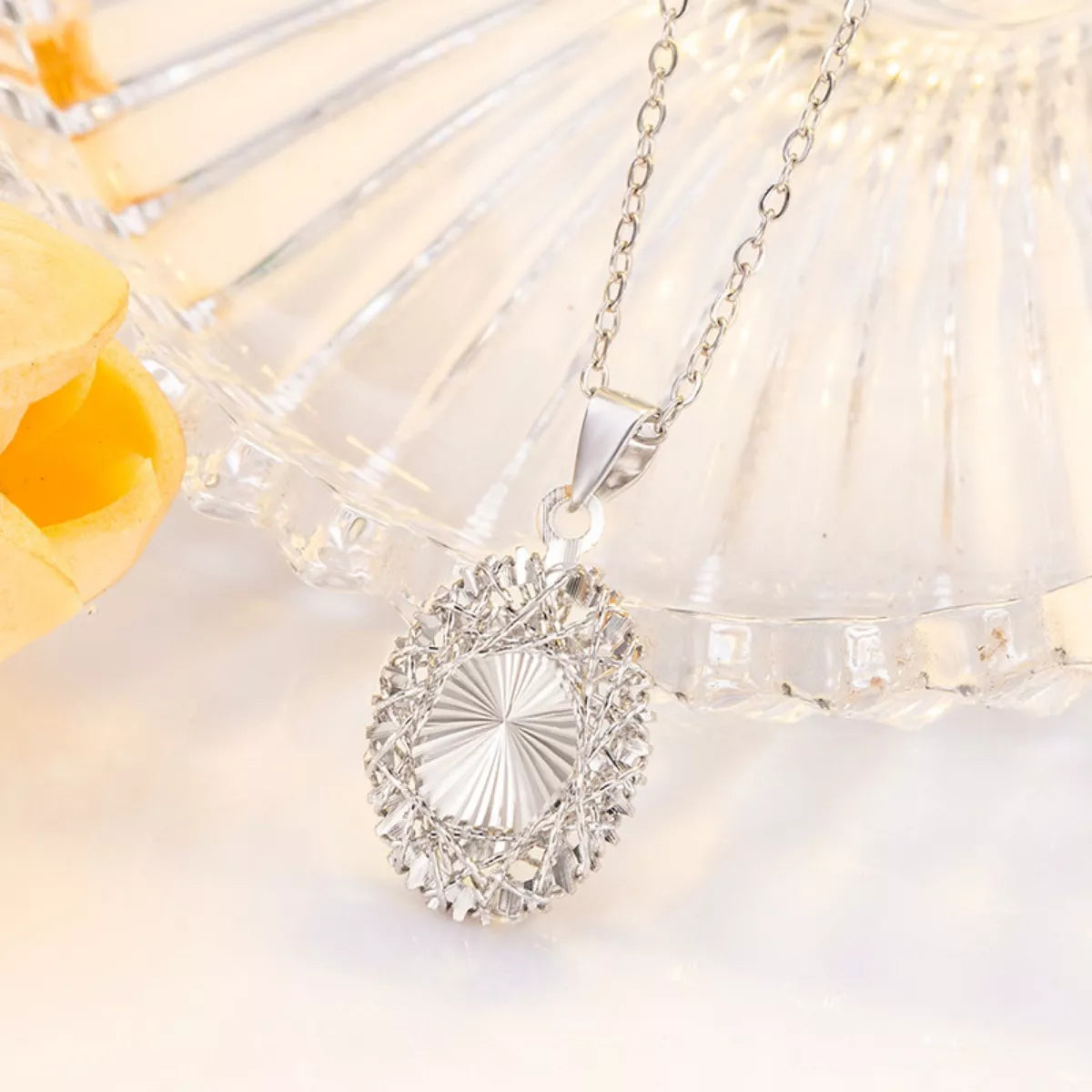 Sterling silver pendant necklace from Plush Fashion Hub, featuring a sleek and elegant design on a delicate chain.