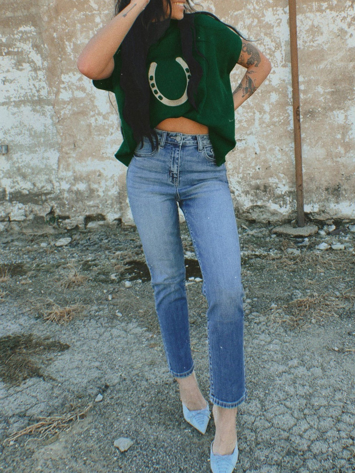 Women's plush fashion hub horseshoe graphic ribbed knit short sleeve sweater with a cozy, fitted design in a soft fabric.