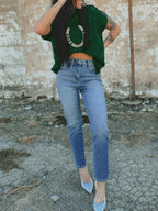 Women's plush fashion hub horseshoe graphic ribbed knit short sleeve sweater with a cozy, fitted design in a soft fabric.