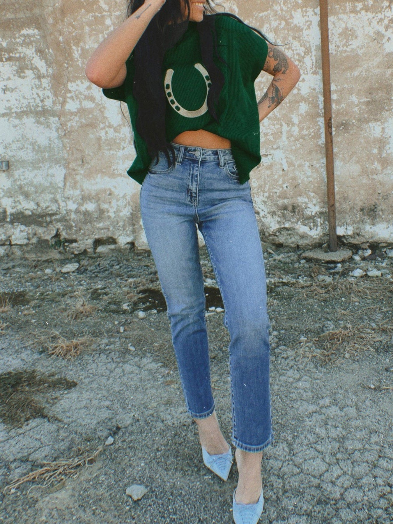 Women's plush fashion hub horseshoe graphic ribbed knit short sleeve sweater with a cozy, fitted design in a soft fabric.