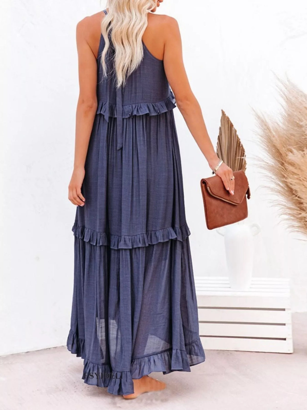 Ruffled tiered sleeveless maxi dress from Plush Fashion Hub featuring flowy fabric and a stylish layered design.