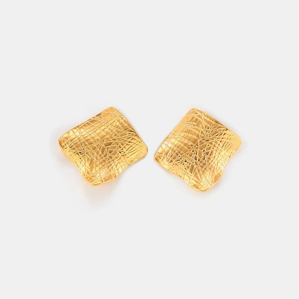 Textured titanium steel stud earrings from Shopimist, close-up of sleek, modern jewelry with a matte finish.