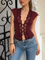 Shopimist lace trim button front vest featuring delicate lace details and a stylish front button closure.