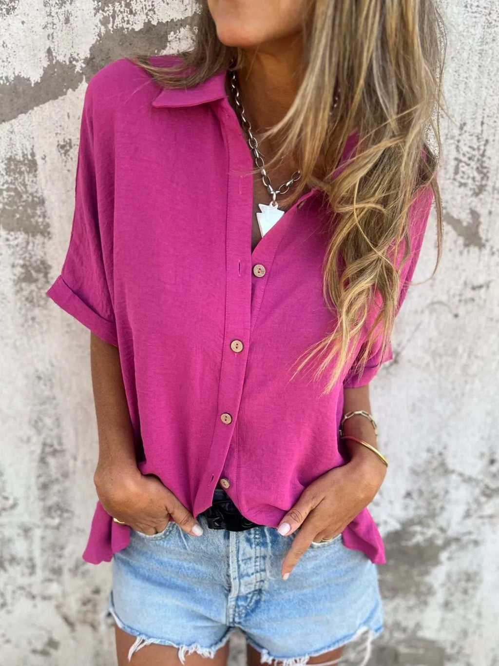 Women's collared half sleeve button-down blouse from Trendsi, featuring a sophisticated office top with a classic design.