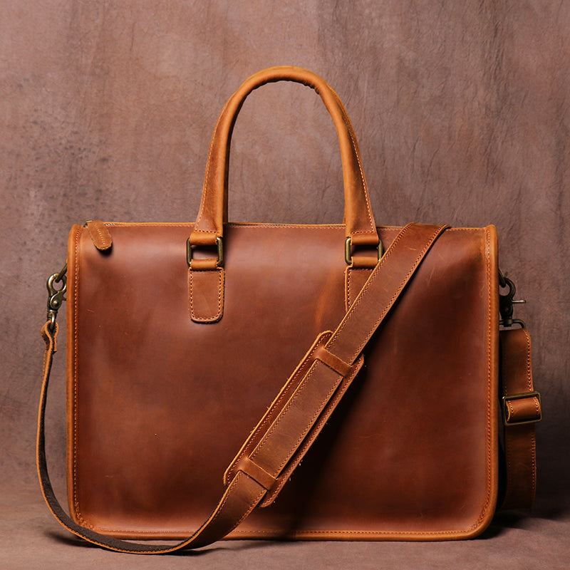 Men's Crazy Horse leather briefcase from Plush Fashion Hub with a sleek design, carrying a laptop with a sturdy handle and classic style.