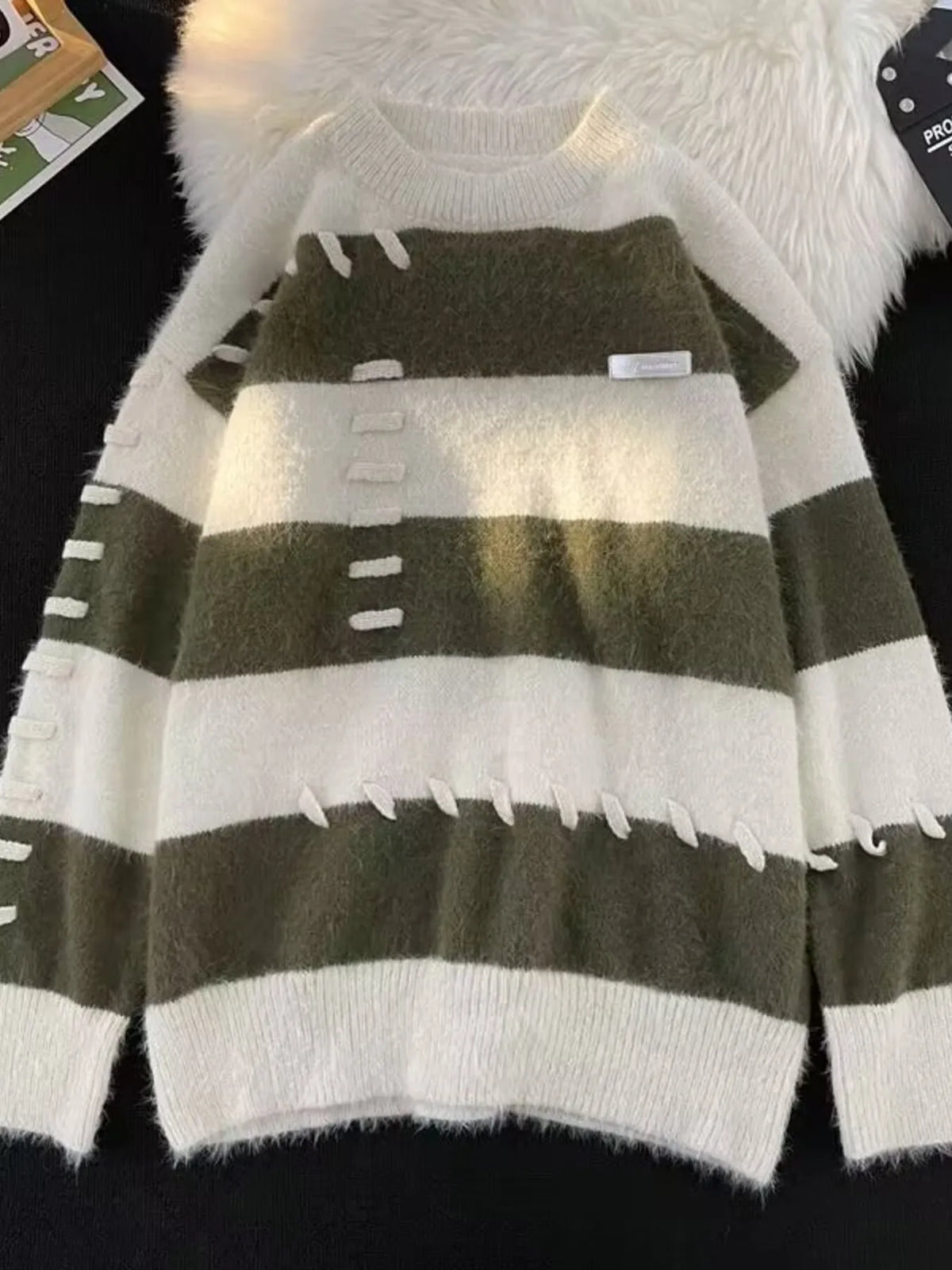 Men's striped knit round neck pullover sweater by Trendsi, showing the stylish multicolored striped pattern and classic fit.