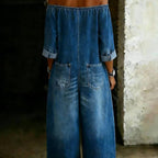 Women's off-shoulder washed faux denim strap overalls jumpsuit, casualwear with relaxed fit and adjustable straps.