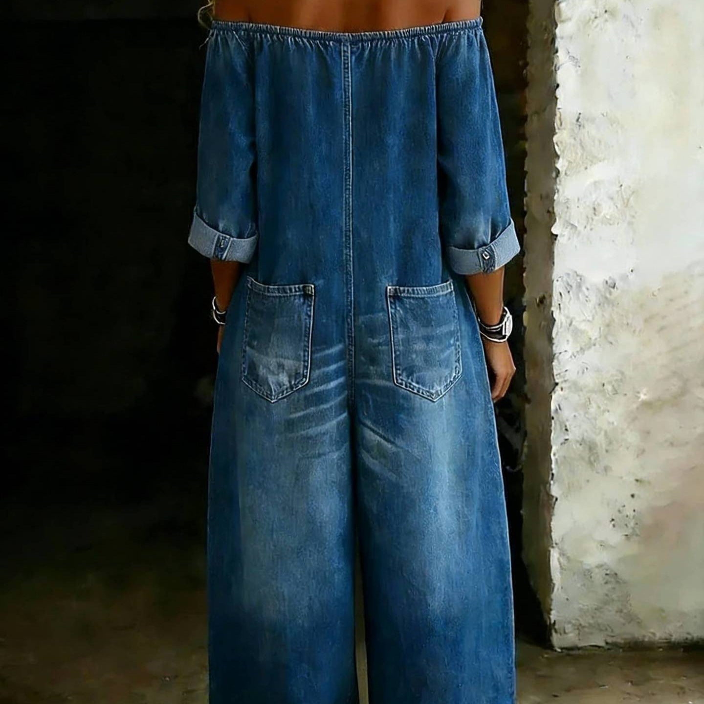 Women's off-shoulder washed faux denim strap overalls jumpsuit, casualwear with relaxed fit and adjustable straps.