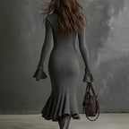 Women's FitiqueFit half zip bodycon dress in casualwear style, showing a fitted black dress with a high neckline and half zipper detail.