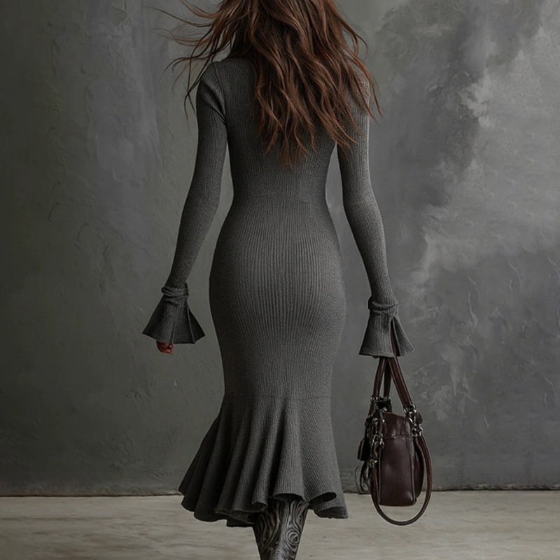 Women's FitiqueFit half zip bodycon dress in casualwear style, showing a fitted black dress with a high neckline and half zipper detail.