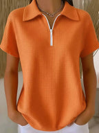 Drop shoulder waffle knit top by Plush Fashion Hub, 3/4 sleeve pullover with half-zip and relaxed fit, shown on a model.