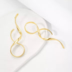 Shopimist alloy spiral drop earrings featuring sleek, curved metal design hanging from delicate hooks.