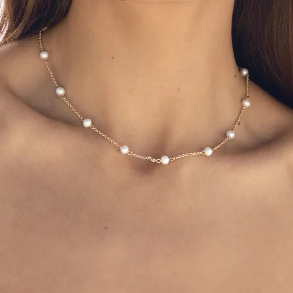 18K gold-plated freshwater pearl necklace with a delicate chain and lustrous pearls, showcasing elegant jewelry design.