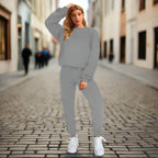 Women's solid color round neck sweatshirt and pants set by Plush Fashion Hub, casualwear with a comfortable fit and simple style.