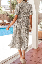 Women's leopard print button-down midi dress from Trendsi, casual chic viscose blend with long sleeves and a relaxed fit.