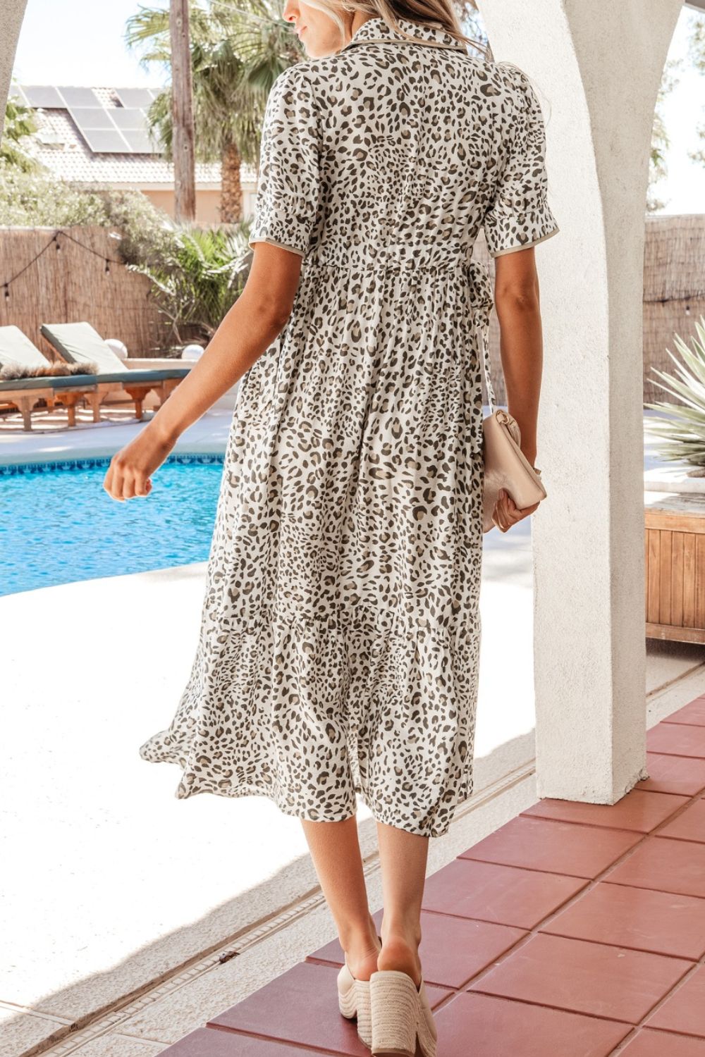 Women's leopard print button-down midi dress from Trendsi, casual chic viscose blend with long sleeves and a relaxed fit.