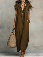 Flowy ruffled V-neck maxi dress by Plush Fashion Hub, featuring a stylish silhouette with ruffle details and a graceful length.
