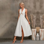 Women's sleeveless halter neck maxi dress by FitiqueFit featuring an A-line high waist silhouette and flowing fabric.