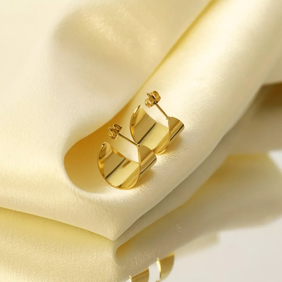 18K gold plated stud earrings from Plush Fashion Hub featuring simple, elegant jewelry with a polished finish.