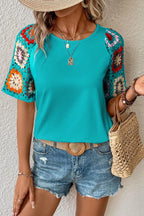 Plush Fashion Hub geometric print round neck short sleeve blouse, stylish and casual top with bold patterns and comfortable fit.