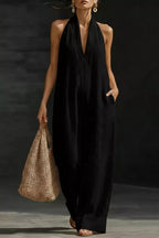 Women's sleeveless wide-leg jumpsuit with pockets, casual chic romper by Trendsi, shown in a stylish, relaxed fit.