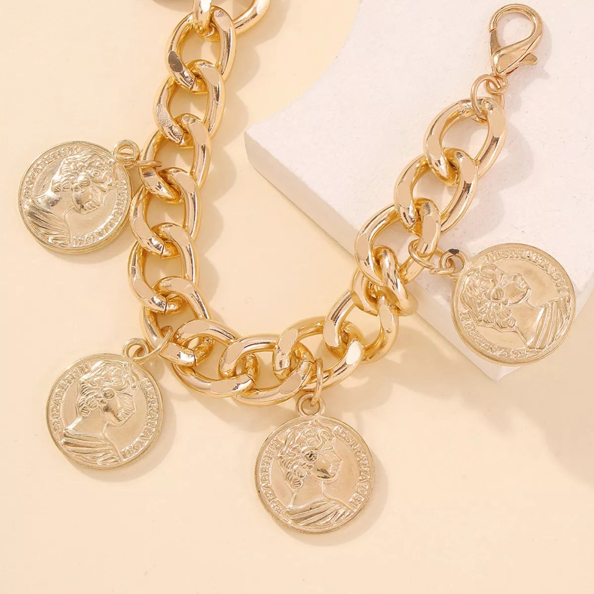 18K gold-plated coin charm bracelet with intricate coin details and chain link design, stylish jewelry by Shopimist
