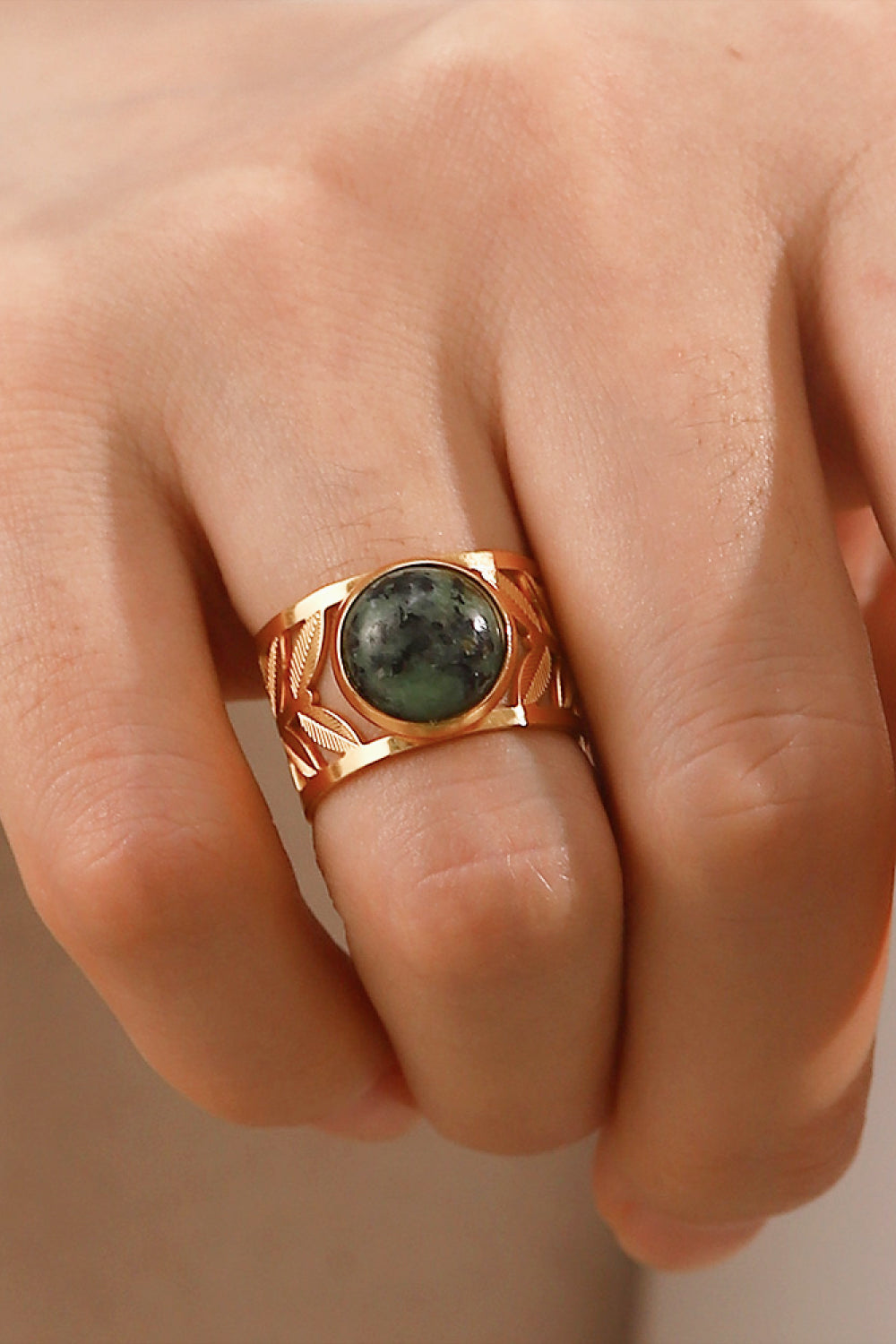 18k gold plated malachite leaf ring with intricate leaf design, showcasing vibrant green malachite gemstone on a delicate gold band