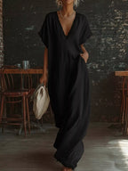 Plus size full-length maxi dress by Shopimist with lace trim V-neck design, flowing fabric, and elegant style.
