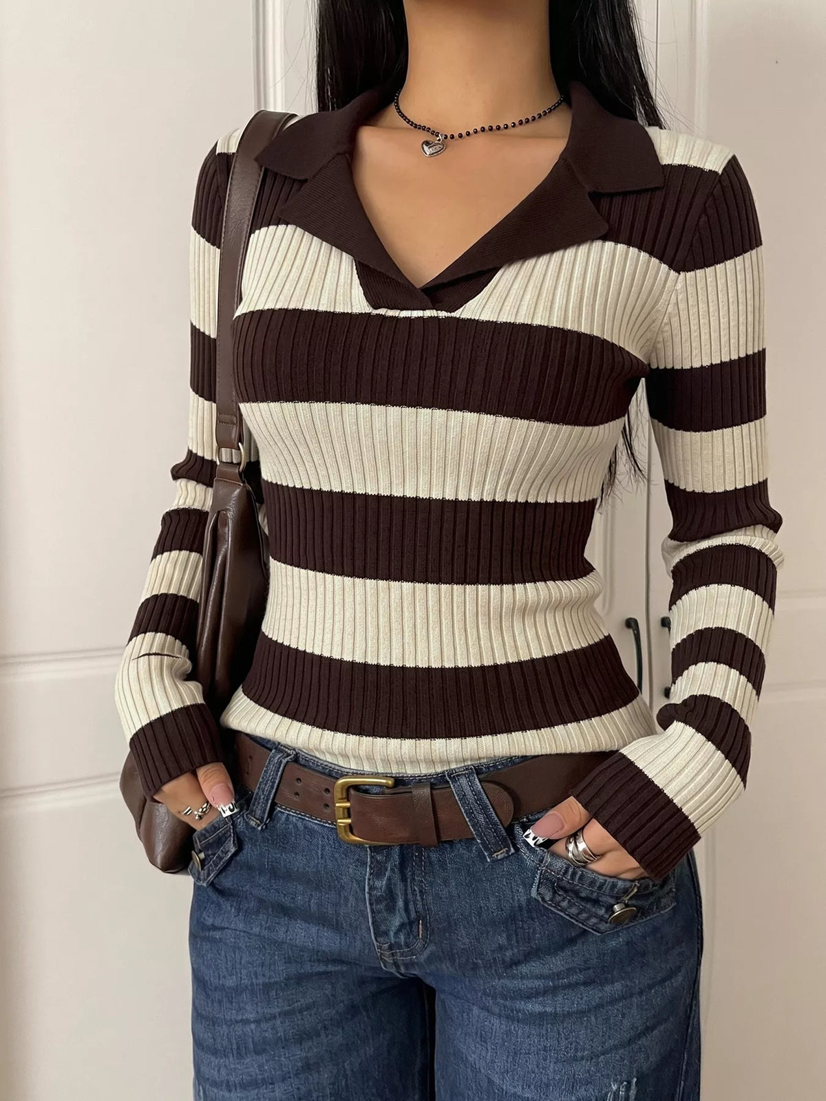 Striped ribbed knit long sleeve sweater shirt from Plush Fashion Hub, showcasing a stylish, fitted design with vibrant stripes.