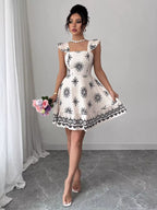 Printed bow back square neck mini dress by Shopimist featuring a stylish square neckline and a bow detail at the back.