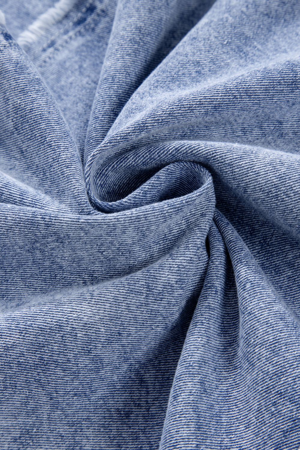 VYSN raw hem button-down long sleeve denim dress hanging on a hanger, showcasing casual stylish denim fashion.
