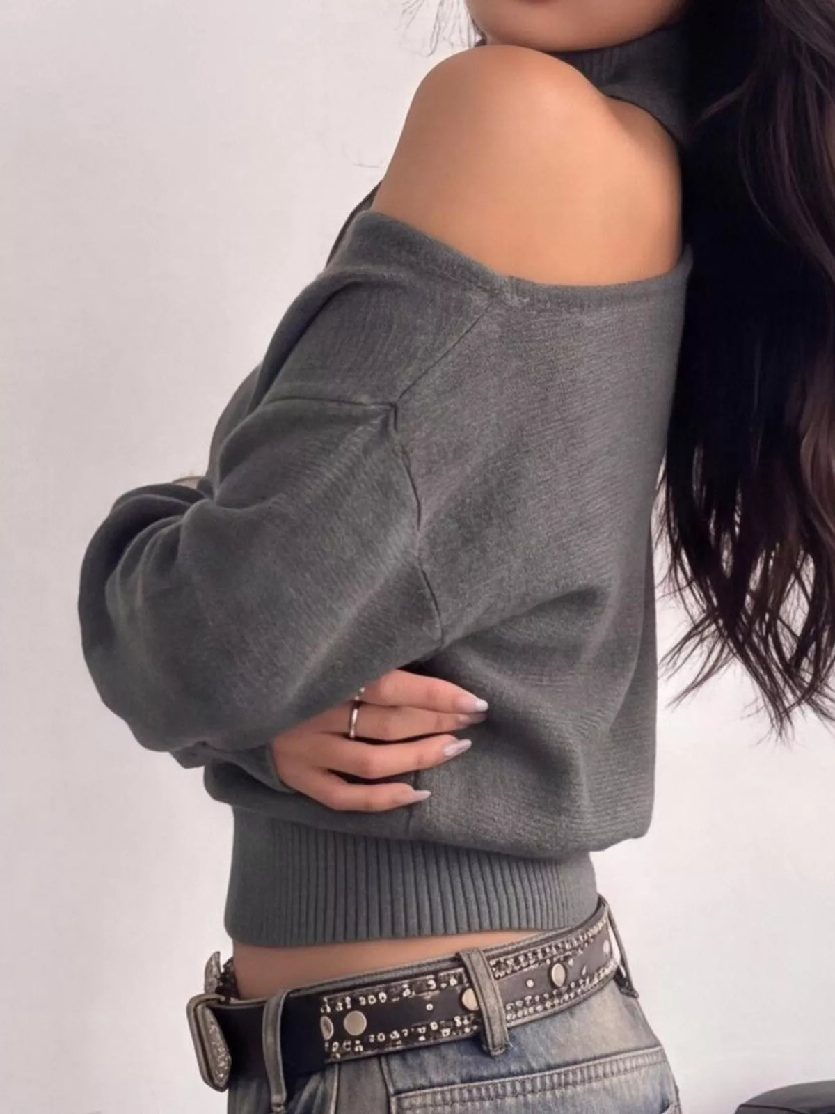 Cold-shoulder dropped shoulder sweater by Trendsi, featuring a cozy knit with open shoulder design and relaxed fit.
