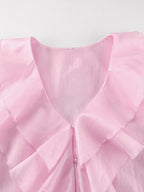 Women's elegant ruffle trim long sleeve blouse in soft Tencel blend, featuring a stylish design and feminine details.