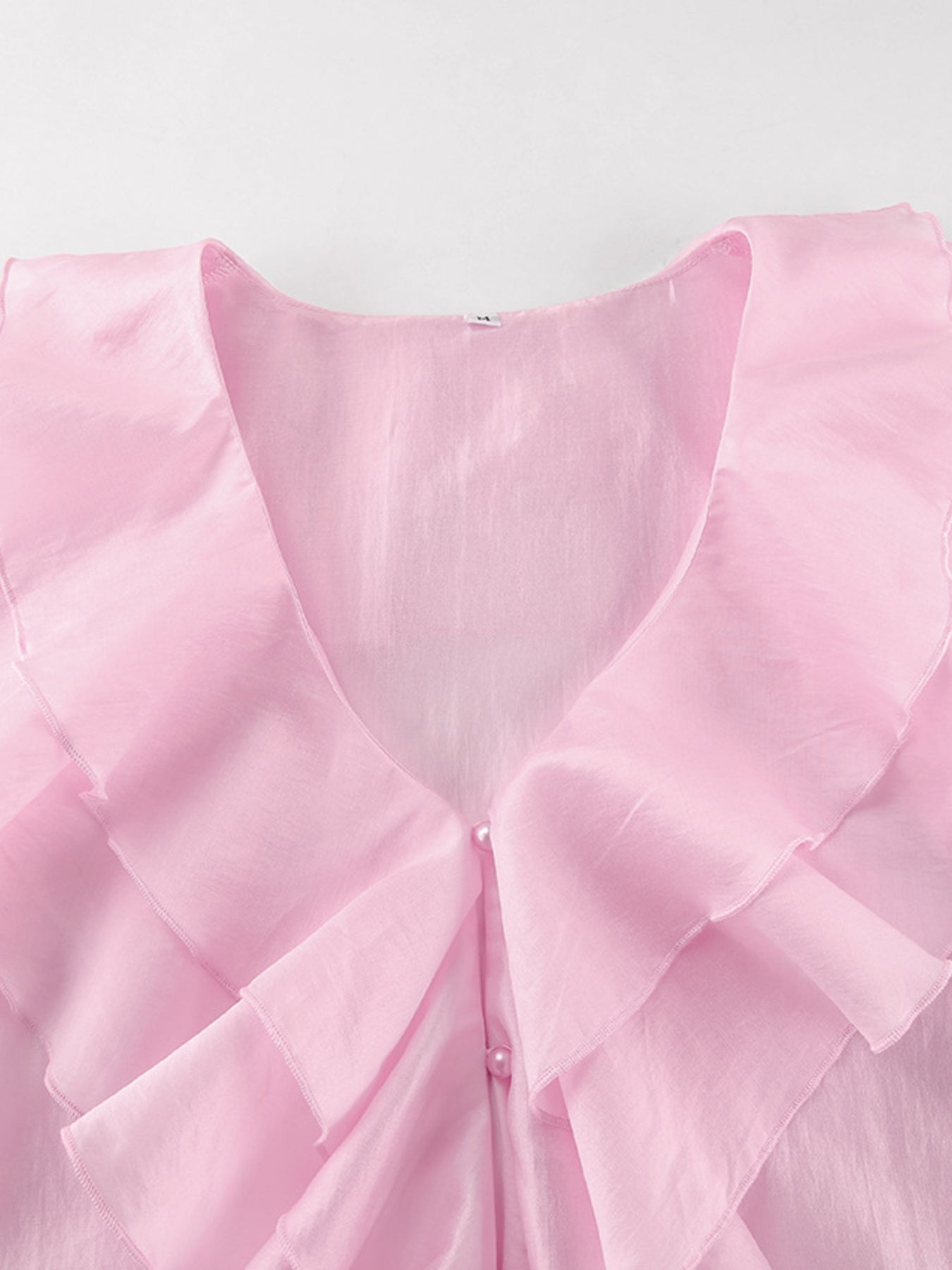 Women's elegant ruffle trim long sleeve blouse in soft Tencel blend, featuring a stylish design and feminine details.