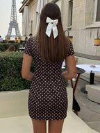 Polka dot cut-out front mini dress by Shopimist featuring a stylish design and playful pattern, perfect for fashionable occasions.