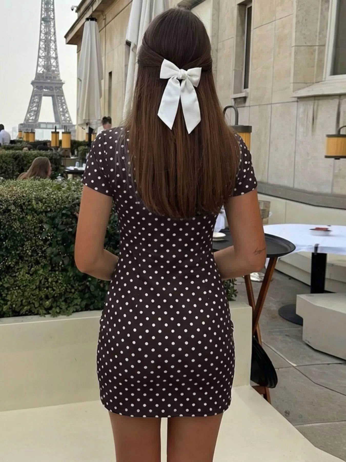Polka dot cut-out front mini dress by Shopimist featuring a stylish design and playful pattern, perfect for fashionable occasions.