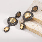 Vintage-inspired dangle earrings with gold accents by Shopimist, featuring intricate design and elegant craftsmanship.