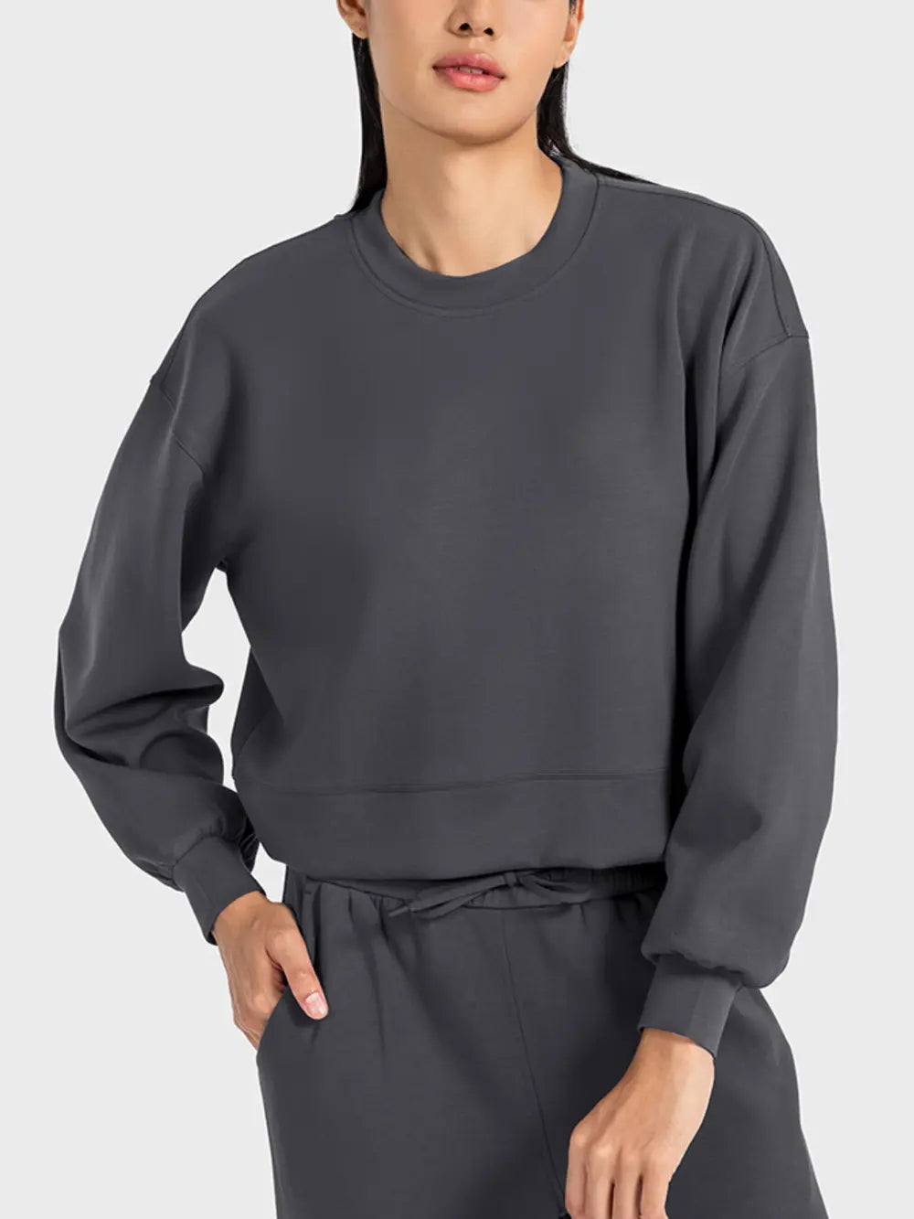 Plush Fashion Hub Millennia round neck drop shoulder sports top in soft fabric, perfect for active wear and casual styling.