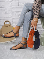 Women's casual ankle strap flat sandals by Trendsi featuring comfortable toe post design, perfect for summer wear.