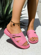 Women's casual faux leather platform slide sandals with cut-out details and comfortable design by Trendsi.