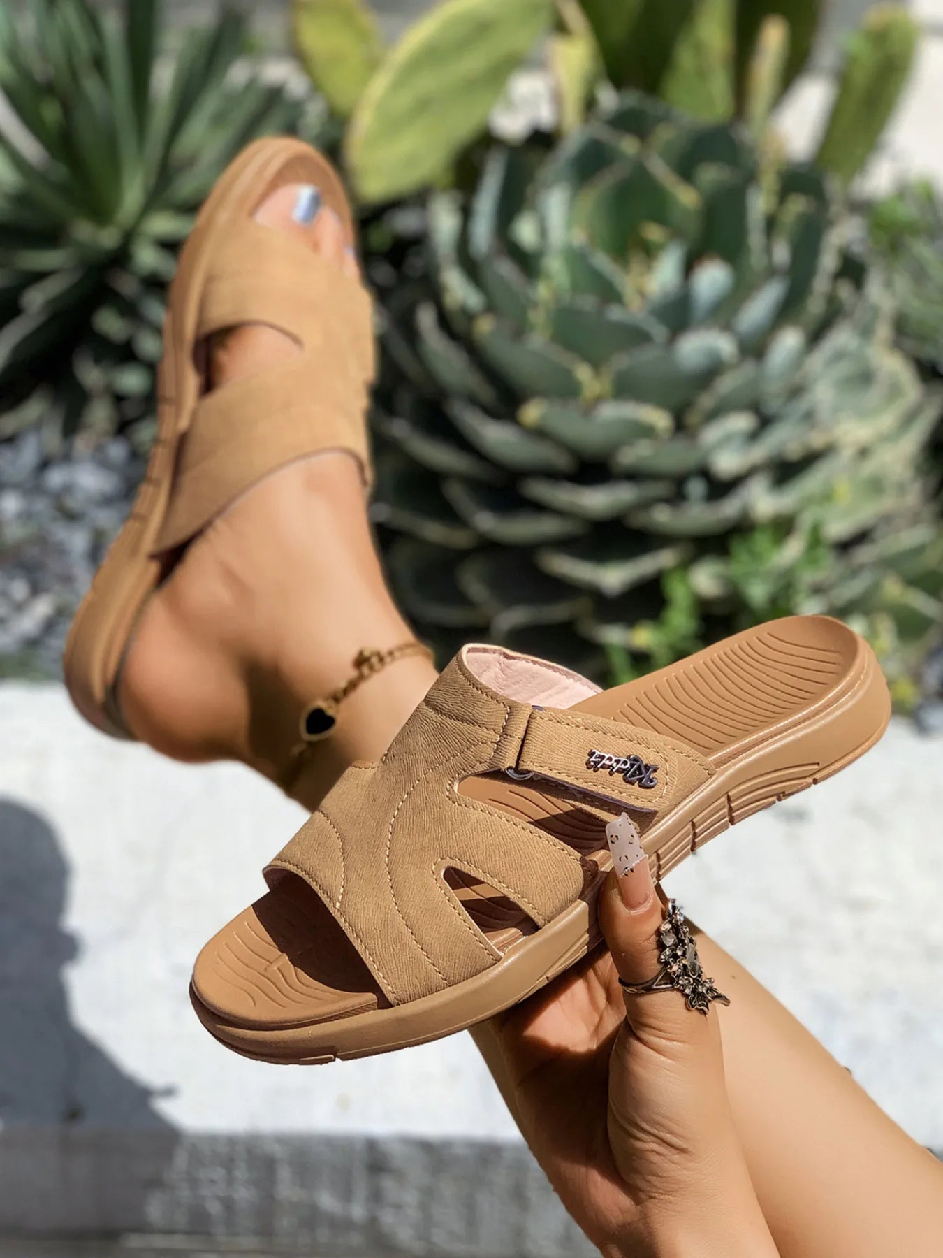 Women's casual faux leather cut-out platform slide sandals with open toes and slip-on design.