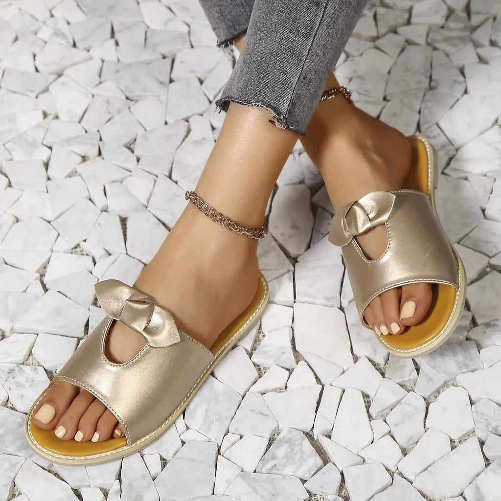 Women's open-toe cutout faux leather flats, comfortable summer sandals with casual style and breathable design.