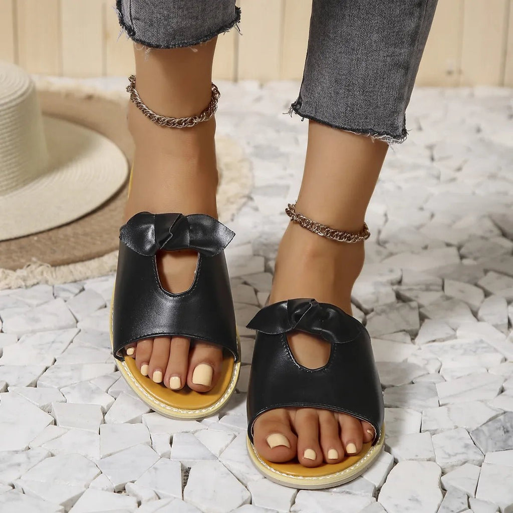Women's casual open-toe cutout faux leather flats, comfortable summer sandals with stylish detail and easy slip-on design.