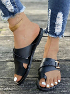 Women's casual buckle toe ring flat sandals by Trendsi, featuring comfortable PU leather slides with open toe design.