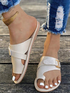 Women's casual buckle toe ring flat sandals by Trendsi, featuring comfortable PU leather slides with open toe design.