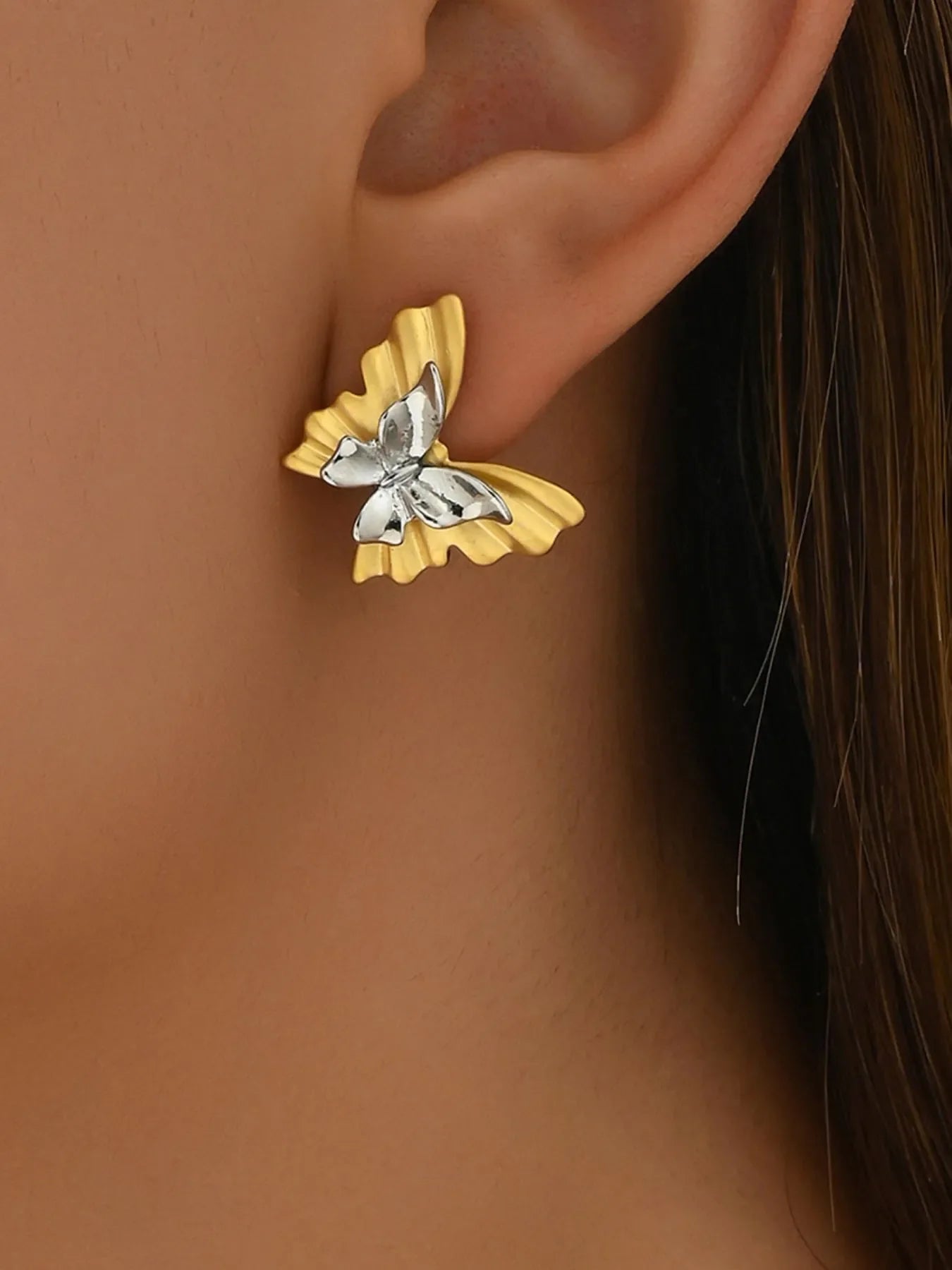 Two-tone stainless steel butterfly earrings from Plush Fashion Hub, showcasing a sleek, stylish design with butterfly motifs.