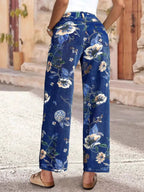 Floral print wide leg jeans by Trendsi, featuring a relaxed fit and vibrant floral pattern, perfect for casual and stylish looks.